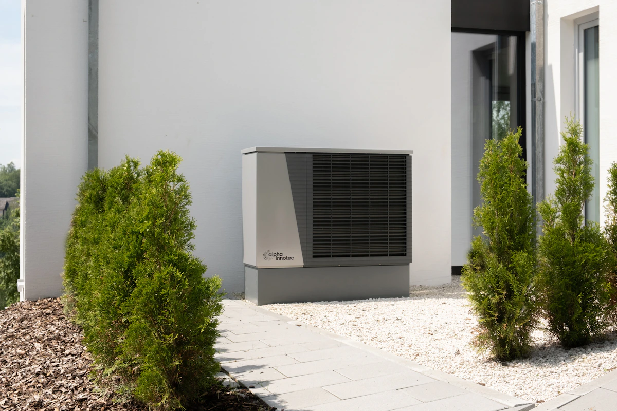 Outdoor heat-pump unit beside a home